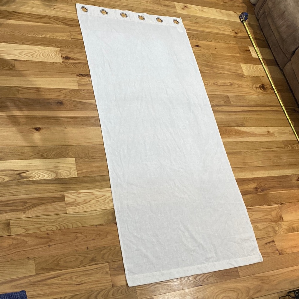 Set of (2) cream colored curtains with silver grommet tops